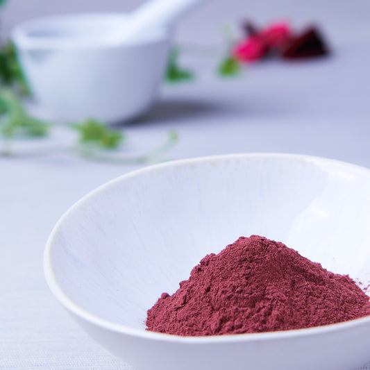 hibiscus jamaica flower powder in white bowl